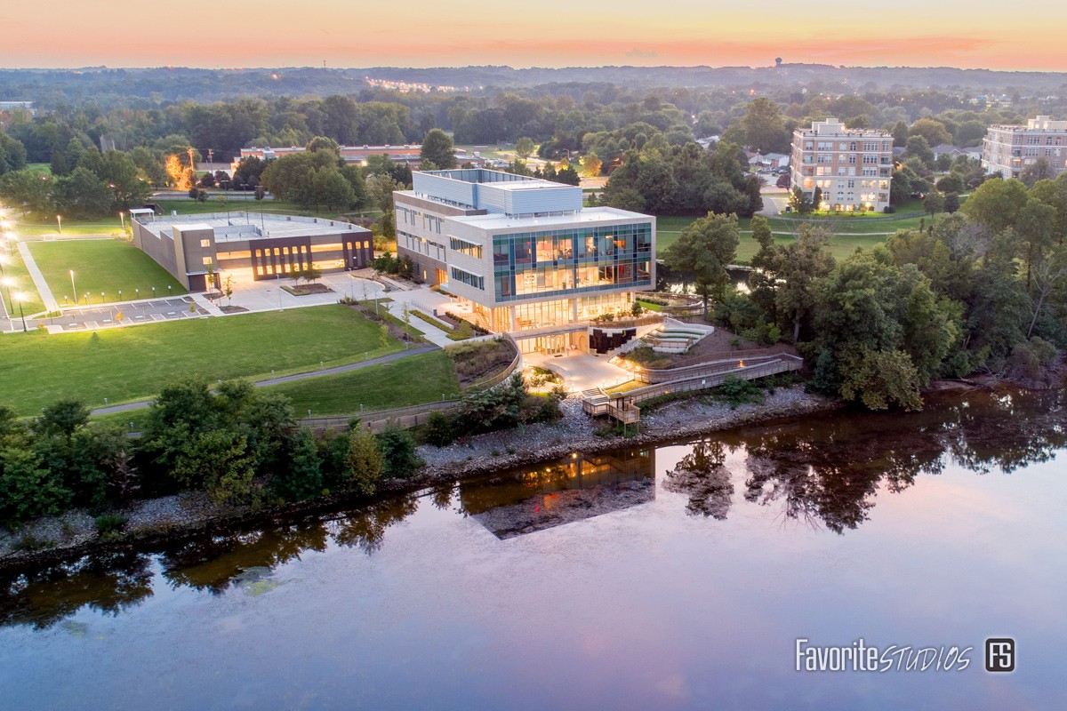National outdoor photography on location at dusk by Favorite Studios with drone over Potomac River of research center building.